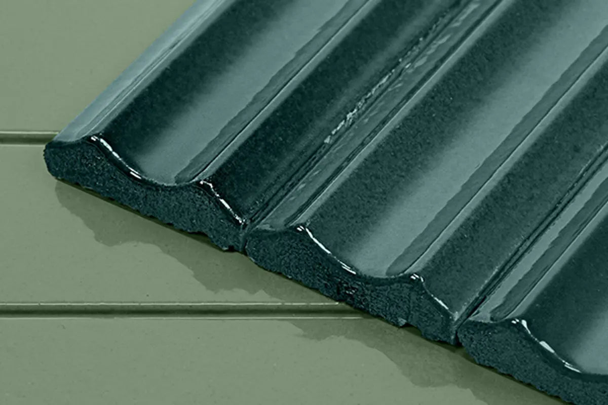 Close-up view of a ridged StoVentec Ceramic tile with an elegant textured surface, showcasing high-end architectural finish options for ventilated rainscreen facades.