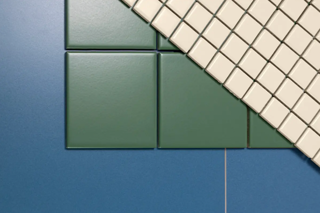Close-up image showing various StoVentec Ceramic tile options in multiple colours and sizes, highlighting the aesthetic versatility and customization potential for rainscreen facades.