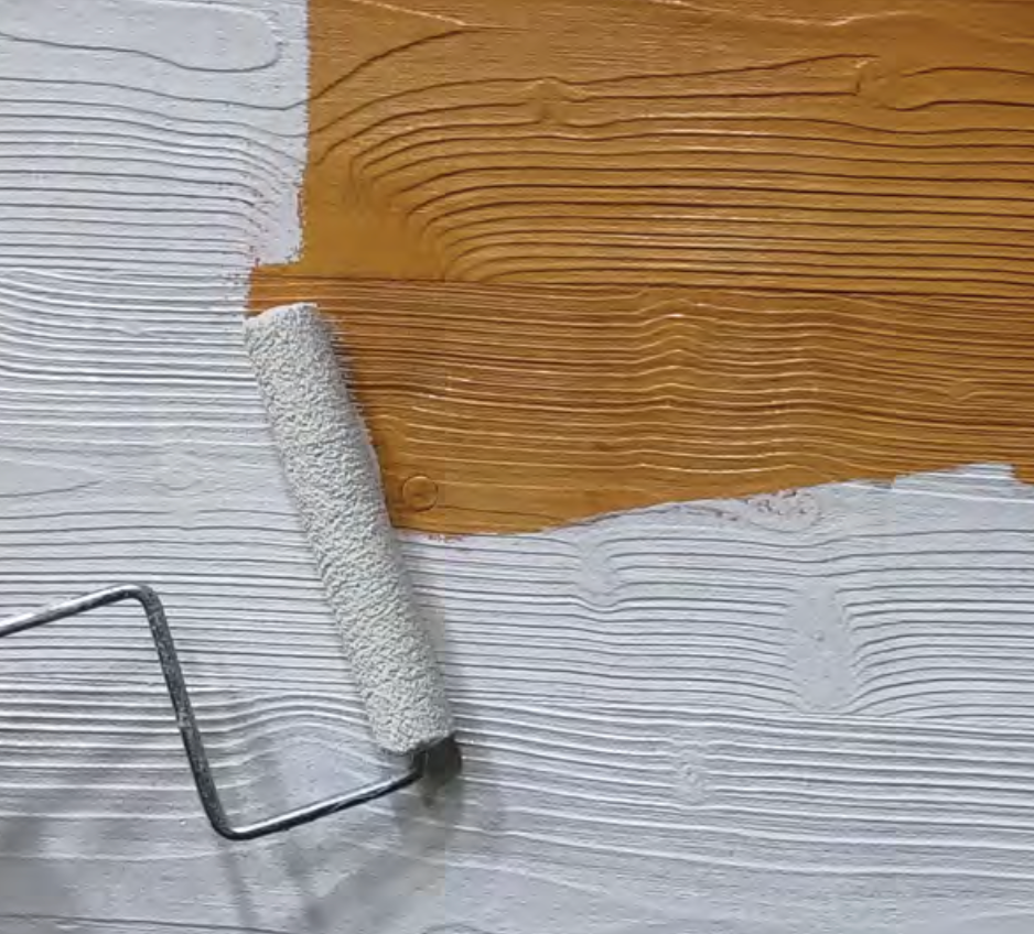 Stocolor wood stain applied with roller on Stocast wood surface, exterior wood cladding protection and finish, close-up detail