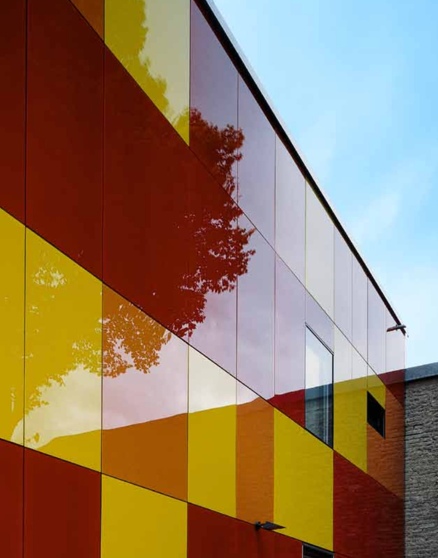 Stoventec stucco system featuring glass panels in multiple colours on building facade