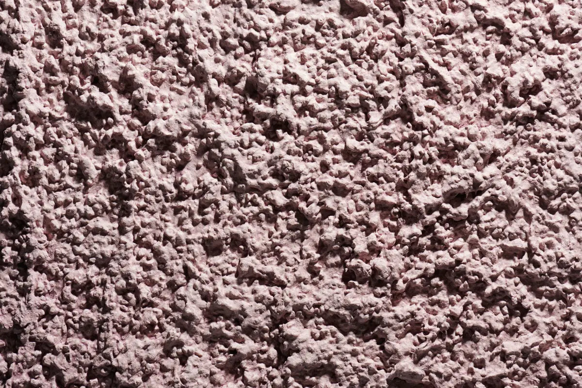 Close-up of rough acrylic stucco finish with popcorn-like texture from Sto, designed for high-performance EIFS and rainscreen systems in harsh Atlantic climates