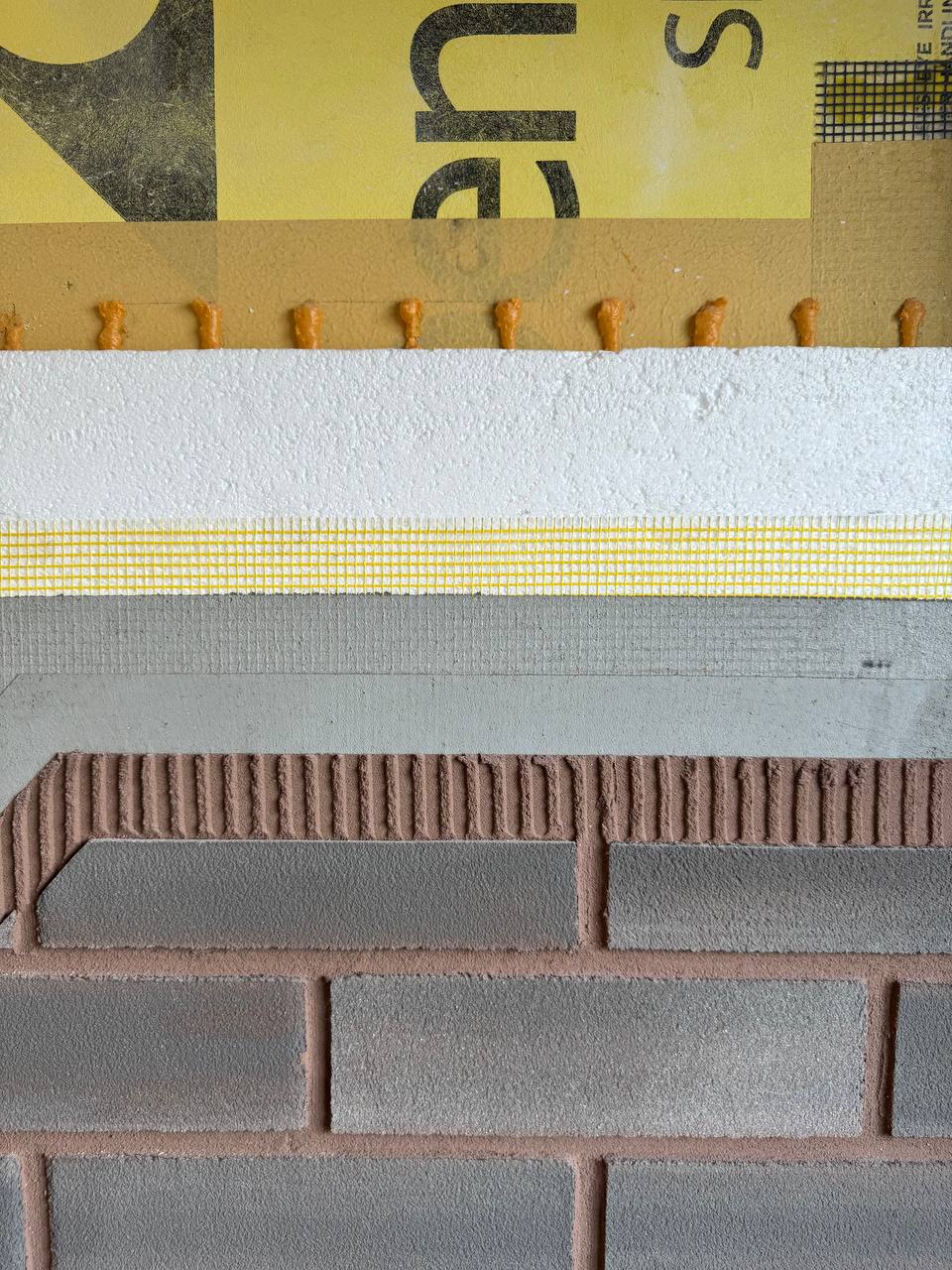 Diagram of full EIFS system highlighting Sto Mesh position as the wall reinforcement layer between basecoat and insulation