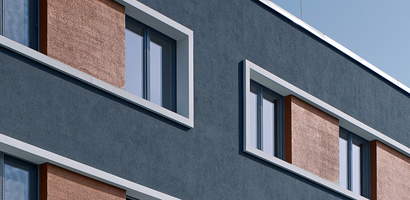 Sto Ventec stucco system with textured finish on modern apartment building faade