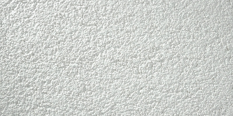Stolit Max Medium textured stucco finish showing medium texture detail and durable acrylic exterior coating close up